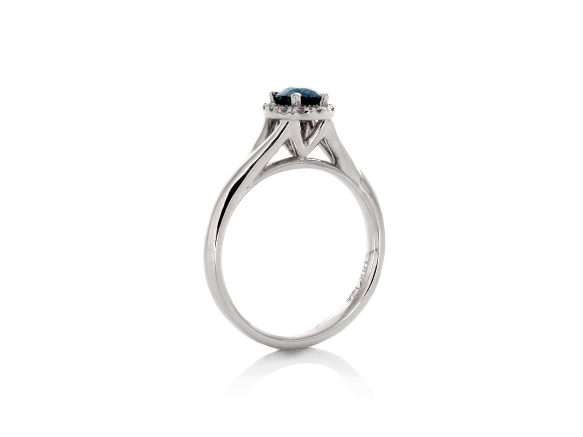 Color Merchants 10k White Gold Oval Blue Topaz And Diamond Three Stone Ring  RM2521W-12 - Royal Fine Jewelers